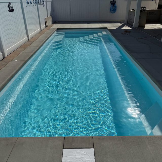 Coral Cay Plunge 30 in Arctic Shimmer — compact fiberglass pool with modern design for small backyard spaces.